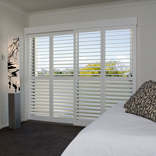 White Shutters in a Bedroom